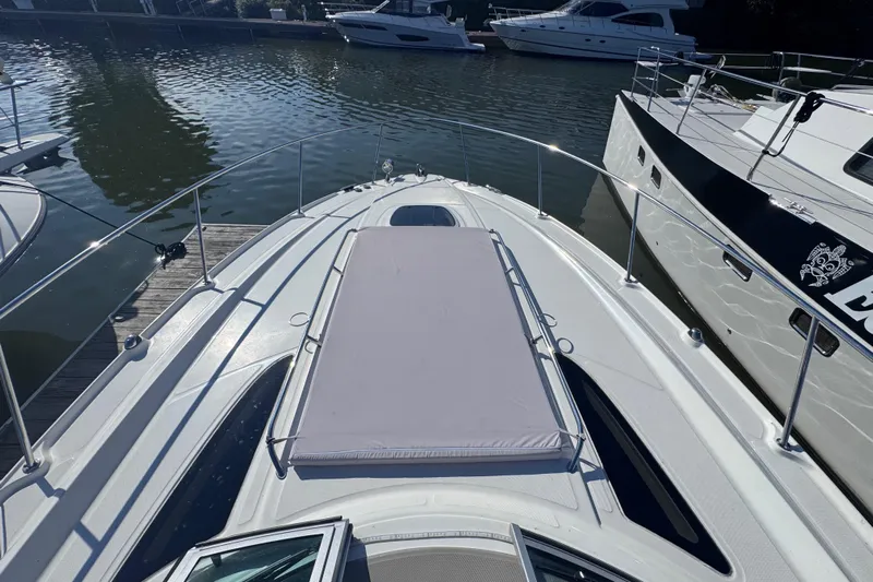  Yacht Photos Pics 2008 Sea Ray 350 Sundancer yacht docked, featuring spacious sunbathing area on deck.