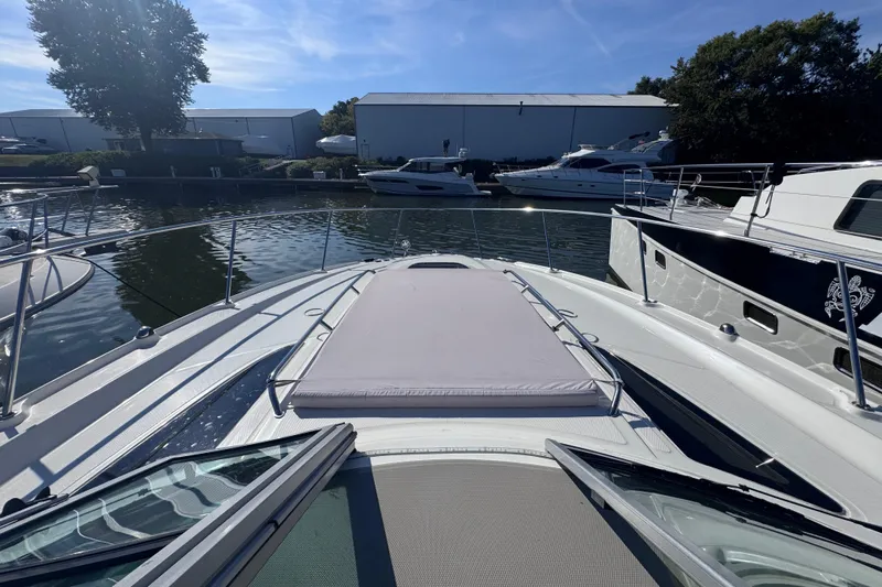  Yacht Photos Pics 2008 Sea Ray 350 Sundancer yacht docked in a marina under clear blue skies.