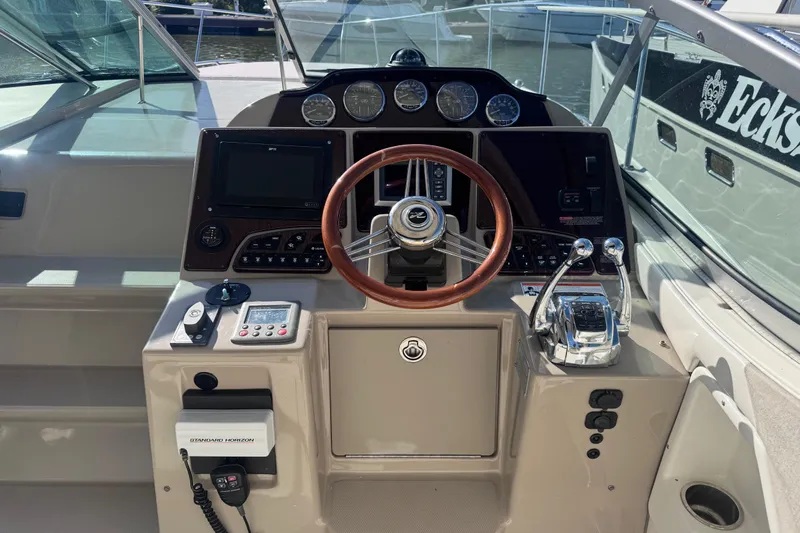 Yacht Photos Pics Helm of 2008 Sea Ray 350 Sundancer with steering wheel and control panel.