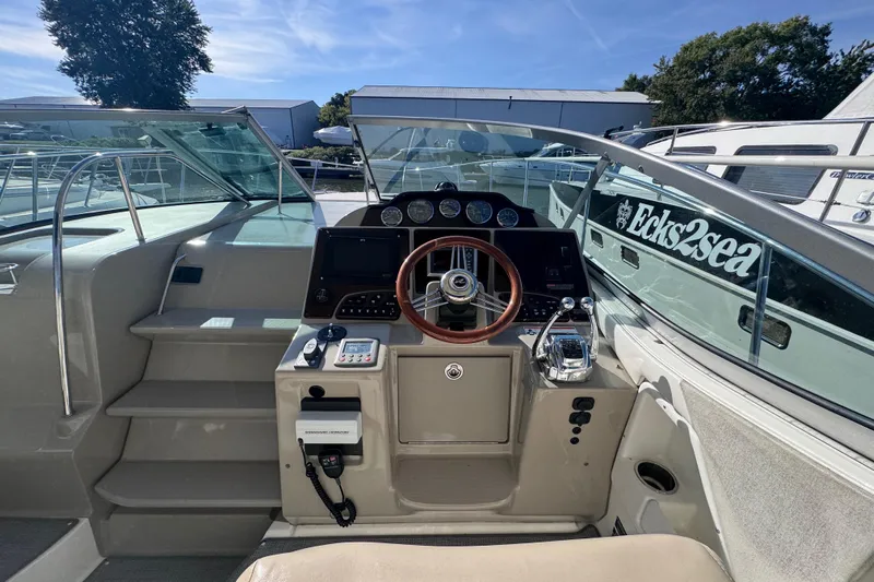  Yacht Photos Pics 2008 Sea Ray 350 Sundancer helm with steering wheel and control panel.