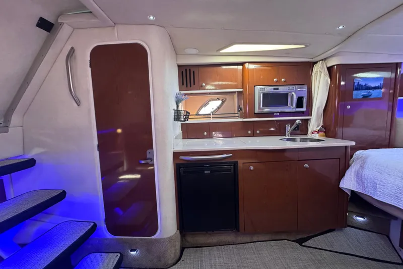 Yacht Photos Pics Interior of 2008 Sea Ray 350 Sundancer yacht with kitchenette and modern amenities.