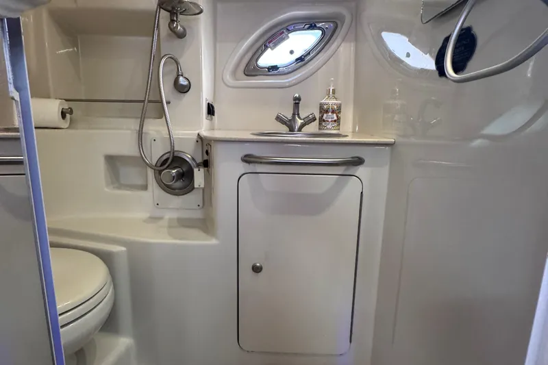  Yacht Photos Pics Bathroom interior of 2008 Sea Ray 350 Sundancer yacht, featuring sink and shower.