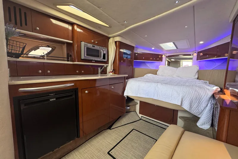  Yacht Photos Pics Luxurious interior of 2008 Sea Ray 350 Sundancer yacht with kitchenette and cozy bed.
