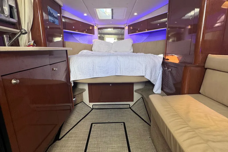 Yacht Photos Pics Luxurious interior of 2008 Sea Ray 350 Sundancer yacht with cozy bed and ambient lighting.
