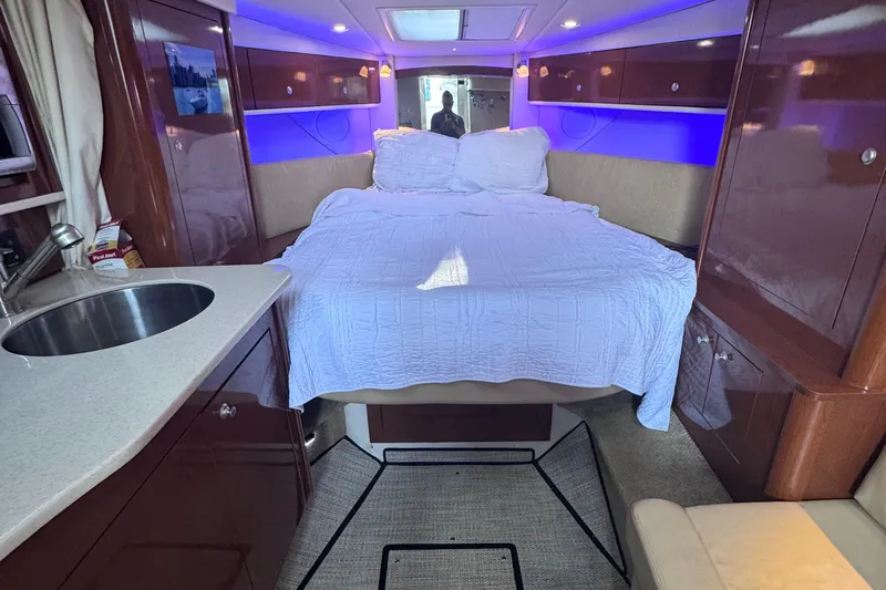  Yacht Photos Pics Interior of 2008 Sea Ray 350 Sundancer with bed, sink, and ambient lighting.