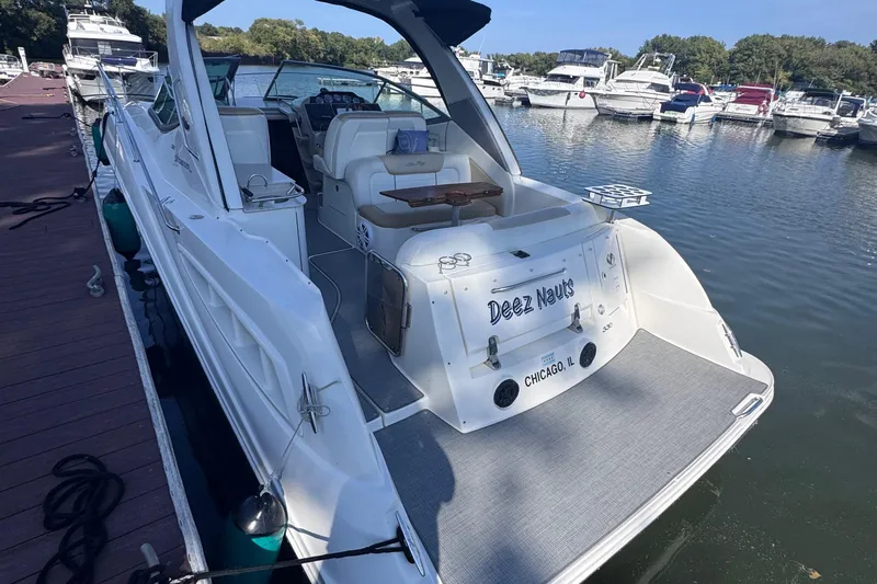  Yacht Photos Pics 2008 Sea Ray 350 Sundancer docked at marina, rear view with seating area.