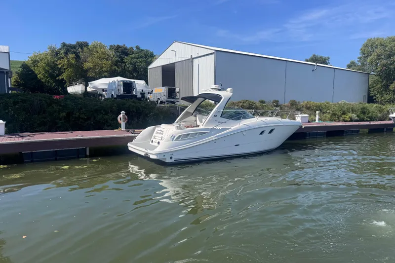  Yacht Photos Pics 2008 Sea Ray 350 Sundancer docked by a marina with clear blue skies.