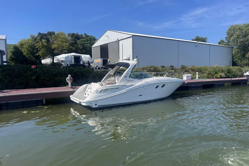  Yacht Photos Pics 2008 Sea Ray 350 Sundancer docked at marina with blue sky background.
