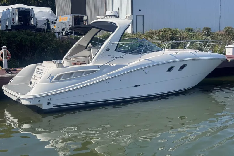  Yacht Photos Pics 2008 Sea Ray 350 Sundancer yacht docked at marina, side view.