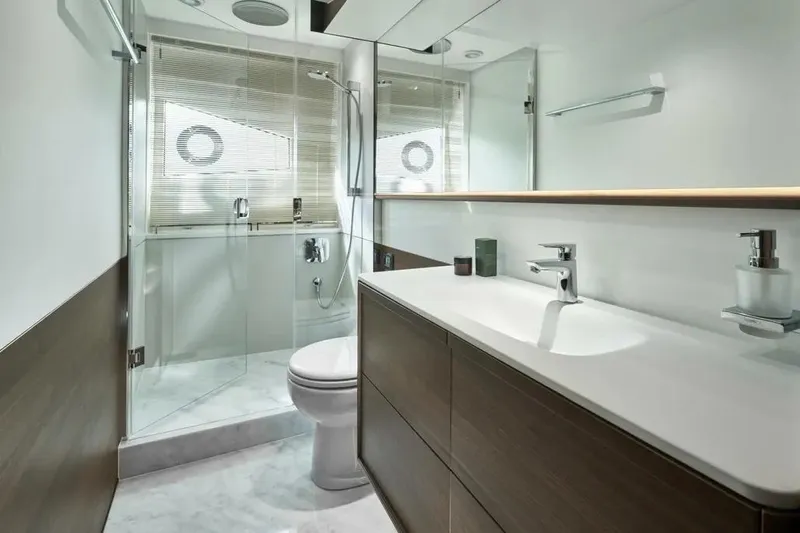  Yacht Photos Pics Modern bathroom interior on 2026 Princess F65 yacht, featuring sleek design and glass shower.