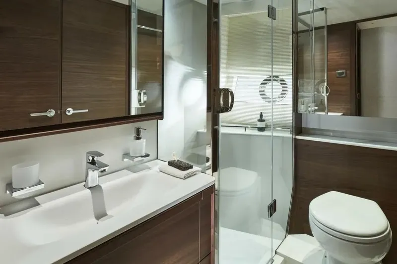  Yacht Photos Pics Luxurious bathroom in 2026 Princess F65 yacht with modern fixtures and elegant design.