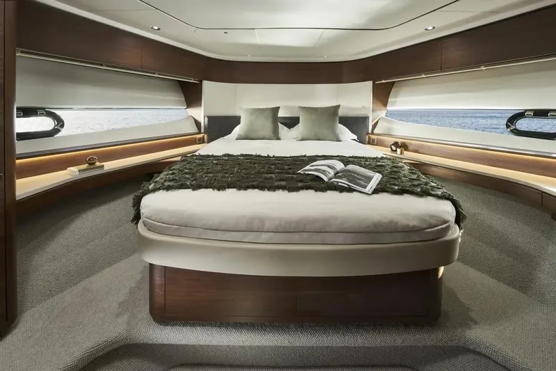  Yacht Photos Pics Luxurious 2026 Princess F65 yacht bedroom with elegant decor and ocean view.