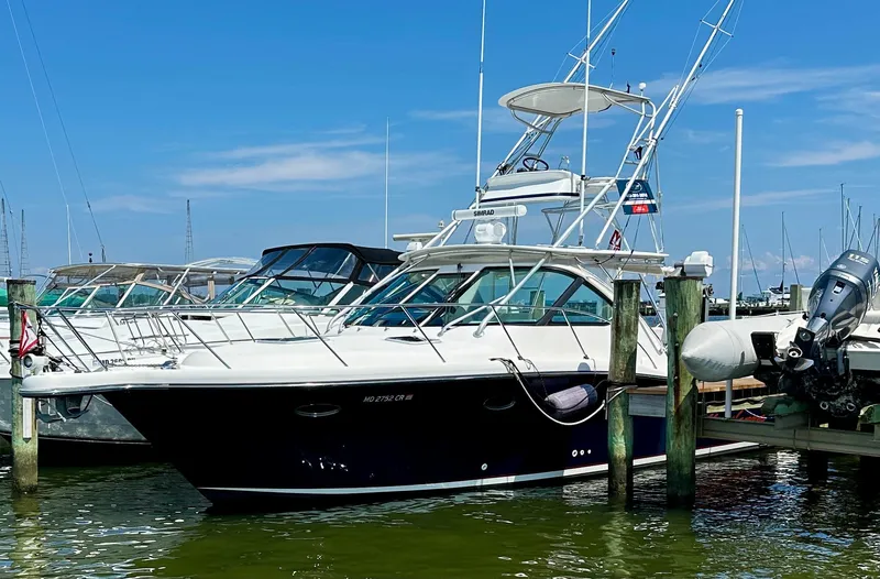  Yacht Photos Pics 2004 Tiara Yachts 3200 Open docked at marina under clear blue sky.