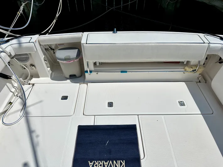  Yacht Photos Pics 2004 Tiara Yachts 3200 Open deck with storage compartments and seating area.