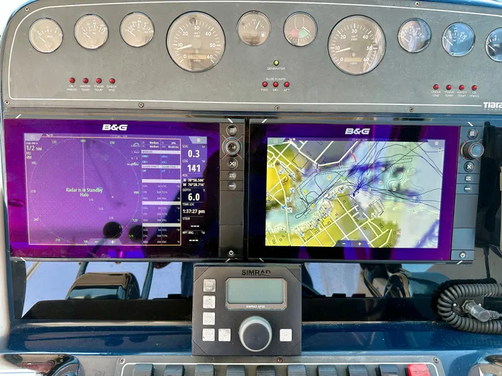  Yacht Photos Pics Dashboard of a 2004 Tiara Yachts 3200 Open with navigation and radar displays.