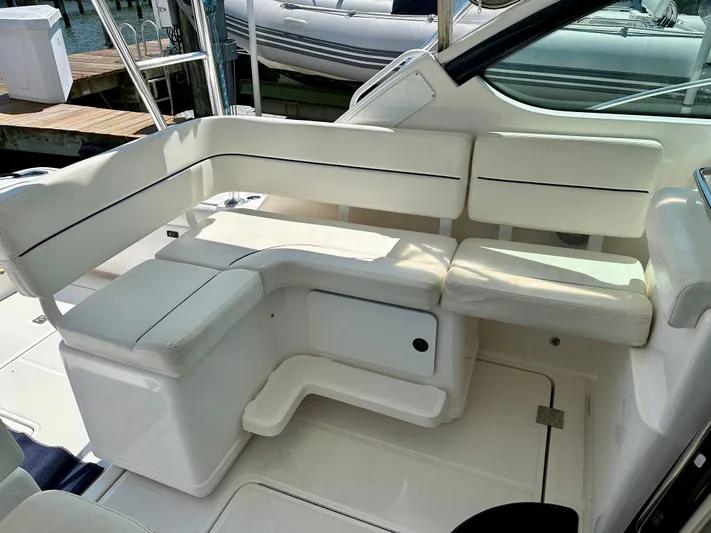  Yacht Photos Pics 2004 Tiara Yachts 3200 Open interior seating area with white cushioned seats.