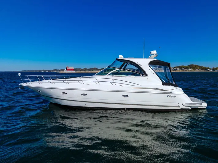 Escape Yacht Photos Pics 2005 Cruisers Yachts 440 Express on open water, clear sky background.