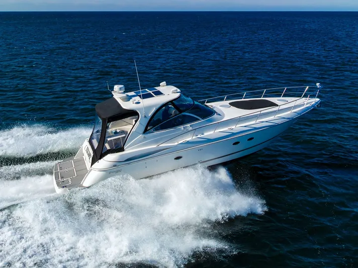 Escape Yacht Photos Pics 2005 Cruisers Yachts 440 Express cruising on open water, showcasing sleek design and performance.