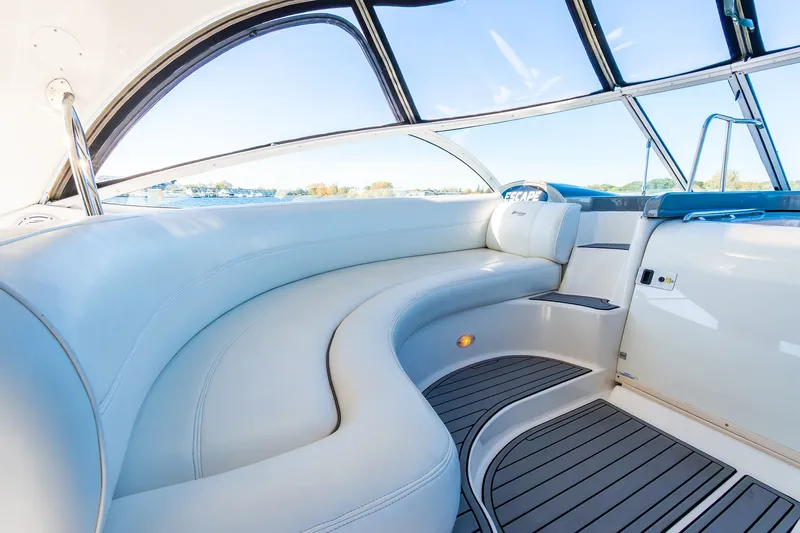 Escape Yacht Photos Pics Luxurious interior of 2005 Cruisers Yachts 440 Express with elegant seating and panoramic windows.