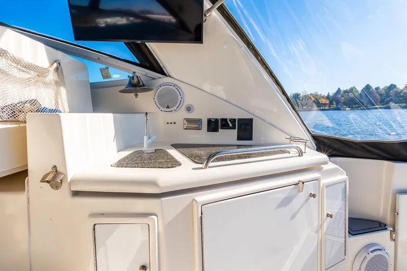 Escape Yacht Photos Pics 2005 Cruisers Yachts 440 Express interior with kitchenette, lake view, and modern amenities.