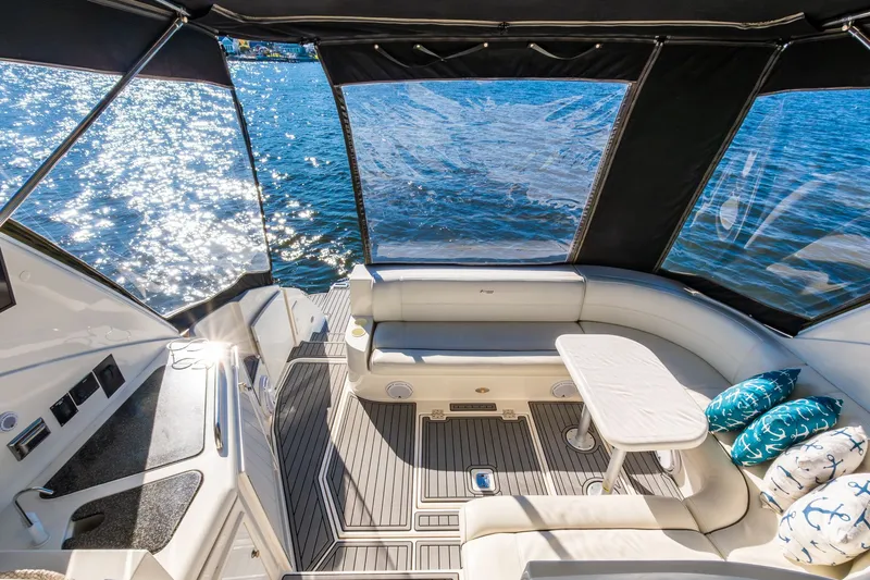 Escape Yacht Photos Pics Luxurious 2005 Cruisers Yachts 440 Express interior with waterfront view and elegant seating.