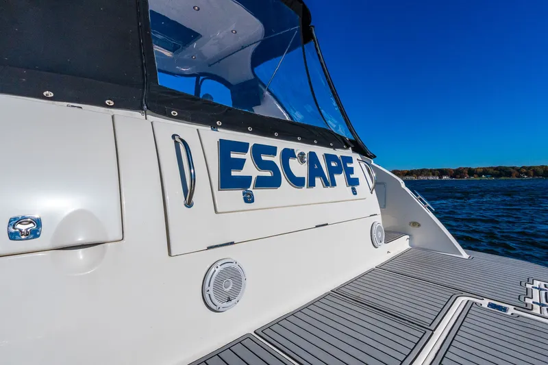 Escape Yacht Photos Pics 2005 Cruisers Yachts 440 Express on water, featuring "Escape" name on the stern.