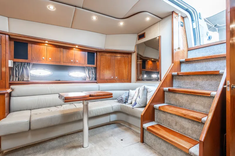 Escape Yacht Photos Pics Luxurious 2005 Cruisers Yachts 440 Express interior with plush seating and elegant wood finishes.