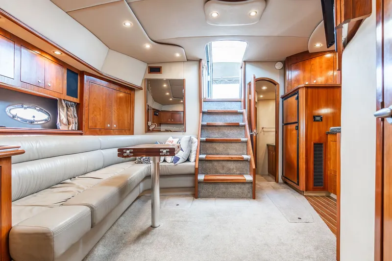Escape Yacht Photos Pics Luxurious 2005 Cruisers Yachts 440 Express interior with elegant wood finishes and plush seating.