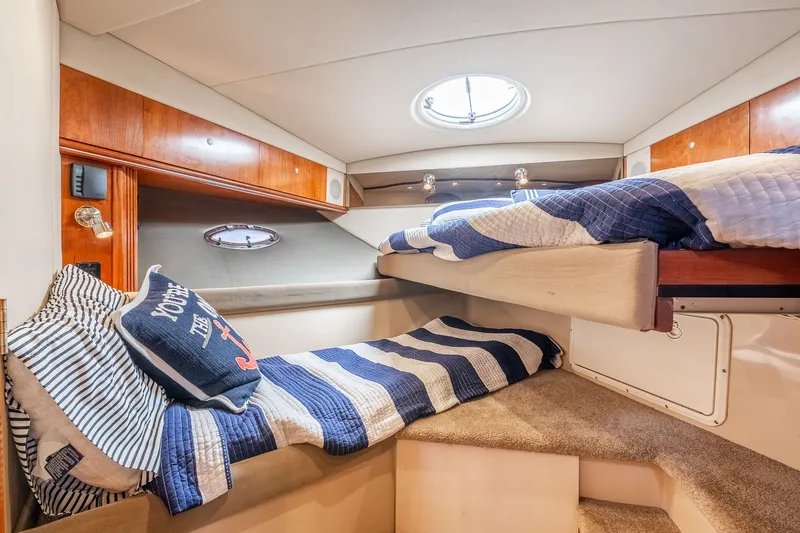 Escape Yacht Photos Pics 2005 Cruisers Yachts 440 Express cabin with cozy bunk beds and nautical decor.