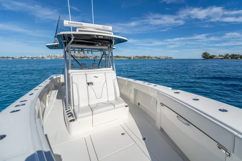 Remote Work Yacht Photos Pics 2021 SeaVee 370z boat on open sea with clear sky.