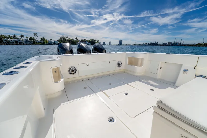 Remote Work Yacht Photos Pics SeaVee 370z boat 2021 with triple outboard engines on calm waters.