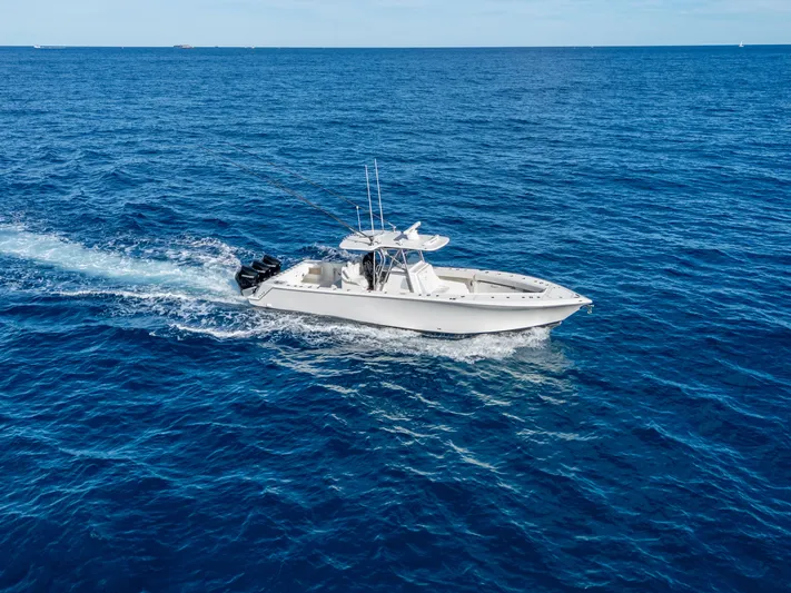 Remote Work Yacht Photos Pics 2021 SeaVee 370z boat cruising on open sea.