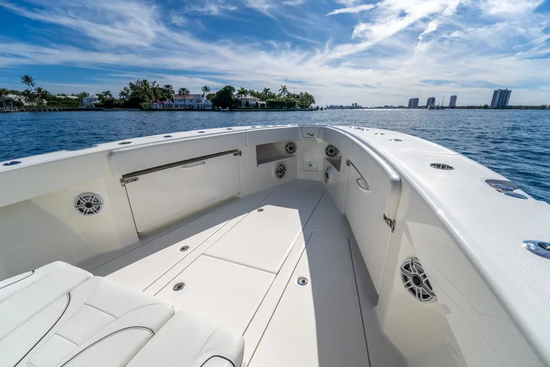 Remote Work Yacht Photos Pics 2021 SeaVee 370z boat on calm water with blue sky.