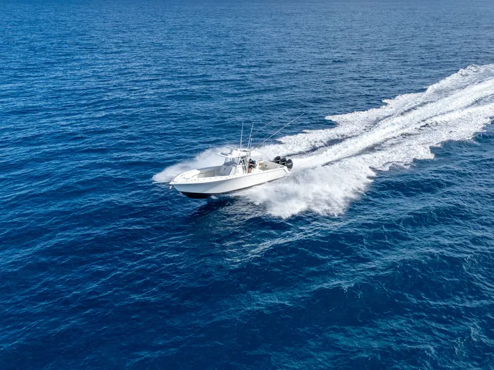 Remote Work Yacht Photos Pics 2021 SeaVee 370z boat cruising on open sea.