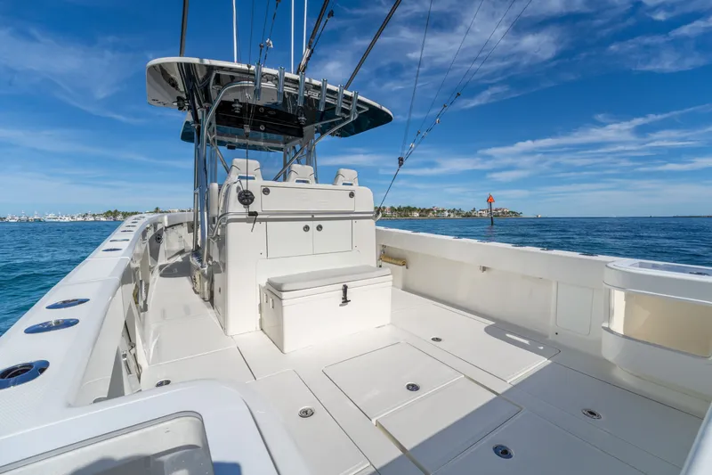 Remote Work Yacht Photos Pics 2021 SeaVee 370z boat on open sea under sunny skies.