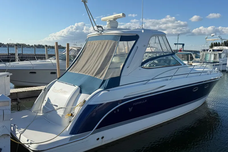 Dream Maker II Yacht Photos Pics 2005 Formula 37 Performance Cruiser docked at marina under clear blue sky.