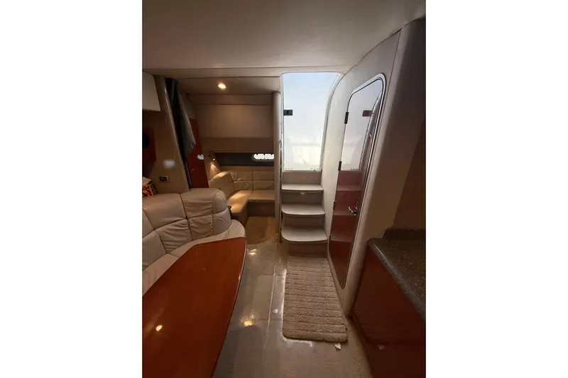 Dream Maker II Yacht Photos Pics Interior of 2005 Formula 37 Performance Cruiser with seating, table, and stairs.