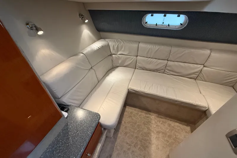 Dream Maker II Yacht Photos Pics Interior of 2005 Formula 37 Performance Cruiser with plush white seating and modern lighting.