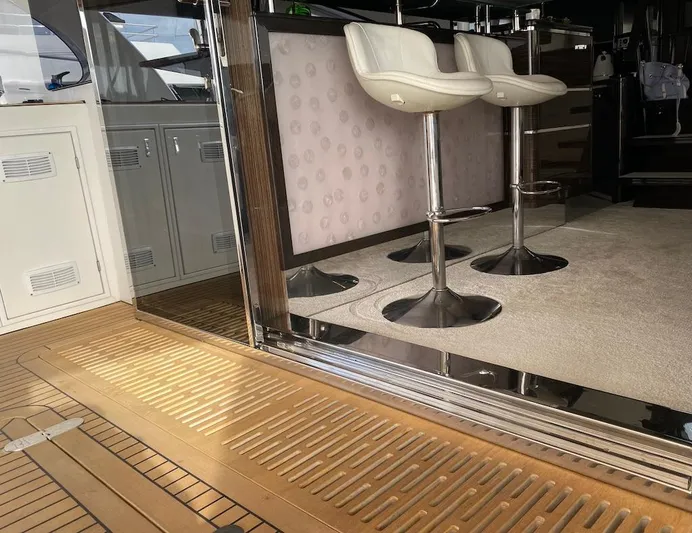 Clouds Yacht Photos Pics Luxurious interior of 2013 Sunreef 70 Power yacht with modern bar stools and sleek design.