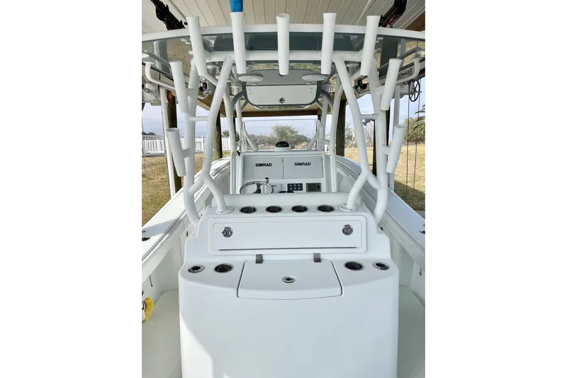  Yacht Photos Pics 2018 Yellowfin 36 Offshore boat interior with rod holders and Simrad electronics.