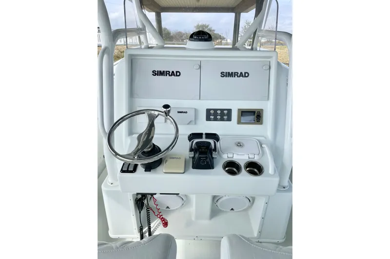  Yacht Photos Pics 2018 Yellowfin 36 Offshore boat console with Simrad electronics and steering wheel.
