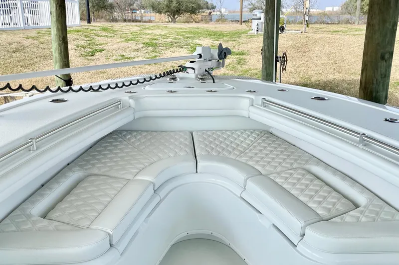  Yacht Photos Pics 2018 Yellowfin 36 Offshore boat with cushioned seating and sleek design.