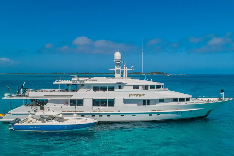 Starship Yacht Photos Pics Luxurious 1988 Van Mill Custom yacht "Star Ship" anchored in clear blue ocean waters.