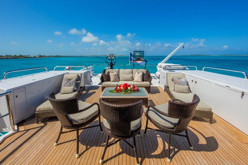 Starship Yacht Photos Pics Luxurious 1988 Van Mill Custom yacht deck with elegant seating, ocean view, and clear blue skies.