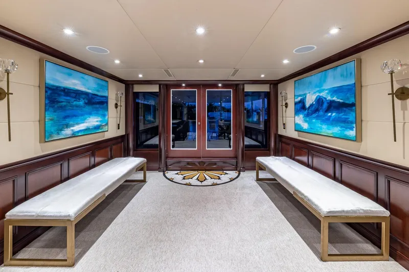 Starship Yacht Photos Pics Luxurious 1988 Van Mill Custom yacht interior with elegant benches and ocean-themed artwork.