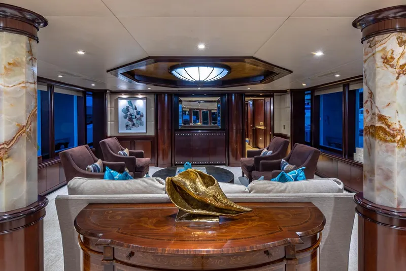 Starship Yacht Photos Pics Luxurious yacht interior with elegant seating, marble columns, and artistic decor, Van Mill Custom 1988.