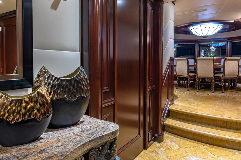 Starship Yacht Photos Pics Luxurious 1988 Van Mill Custom yacht interior with elegant dining area and decorative vases.