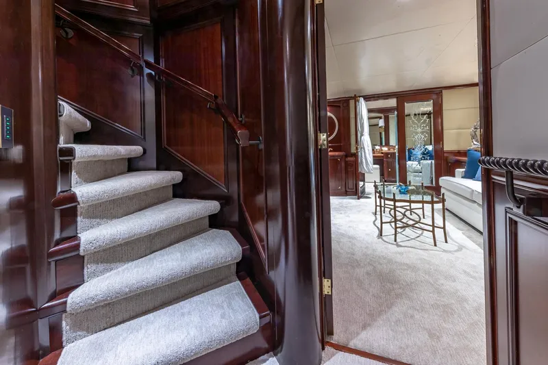 Starship Yacht Photos Pics Luxurious 1988 Van Mill Custom yacht interior with elegant staircase and plush living area.