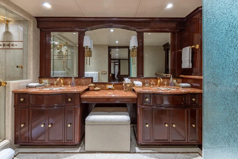 Starship Yacht Photos Pics Luxurious 1988 Van Mill custom bathroom with elegant wood cabinetry and marble countertops.