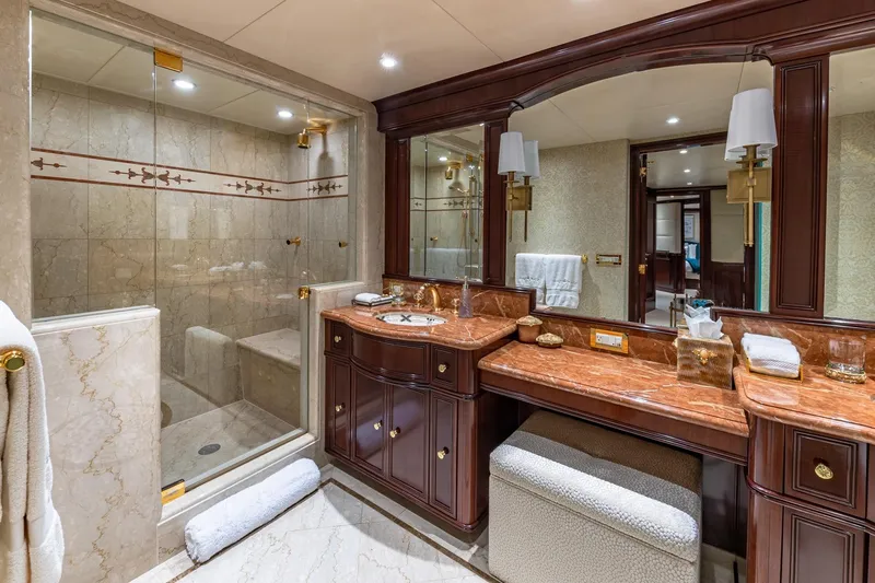 Starship Yacht Photos Pics Luxurious 1988 Van Mill custom bathroom with marble countertops and glass shower enclosure.